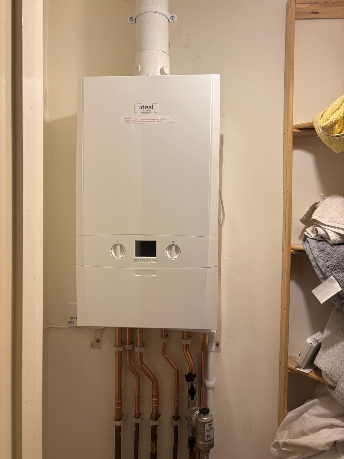 Ideal boiler installed in a homeowner's airing cupboard ready for annual service