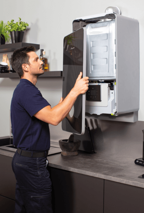 HeatNI engineer servicing a boiler